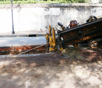 a hole made in the ground to run cables underground,