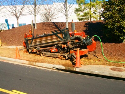 NCI provides outside plant services. ditch machine next to road